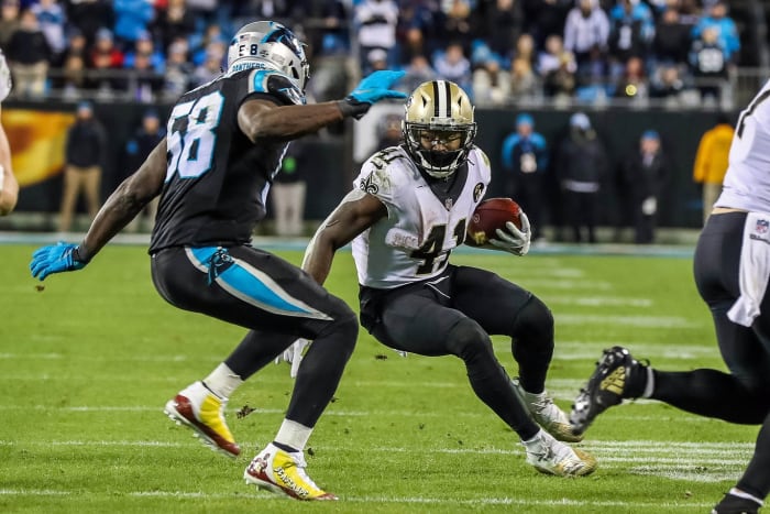 New Orleans Saints running back Alvin Kamara (41) runs the ball against Carolina linebacker Thomas Davis (58). Mandatory Credit: Jim Dedmon-USA TODAY Sports